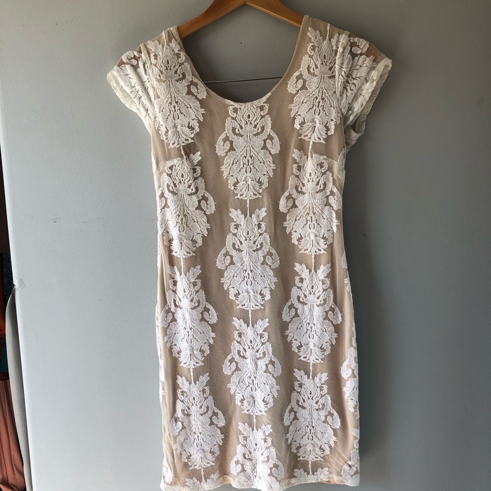 Cream colored dress with damask detailing